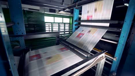 printing machine with many newspapers. workshop of making newspaper.