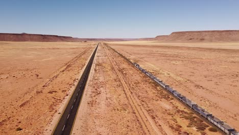 namibian desert train ride: 4k footage of isolated tracks in vast wilderness of the namib desert