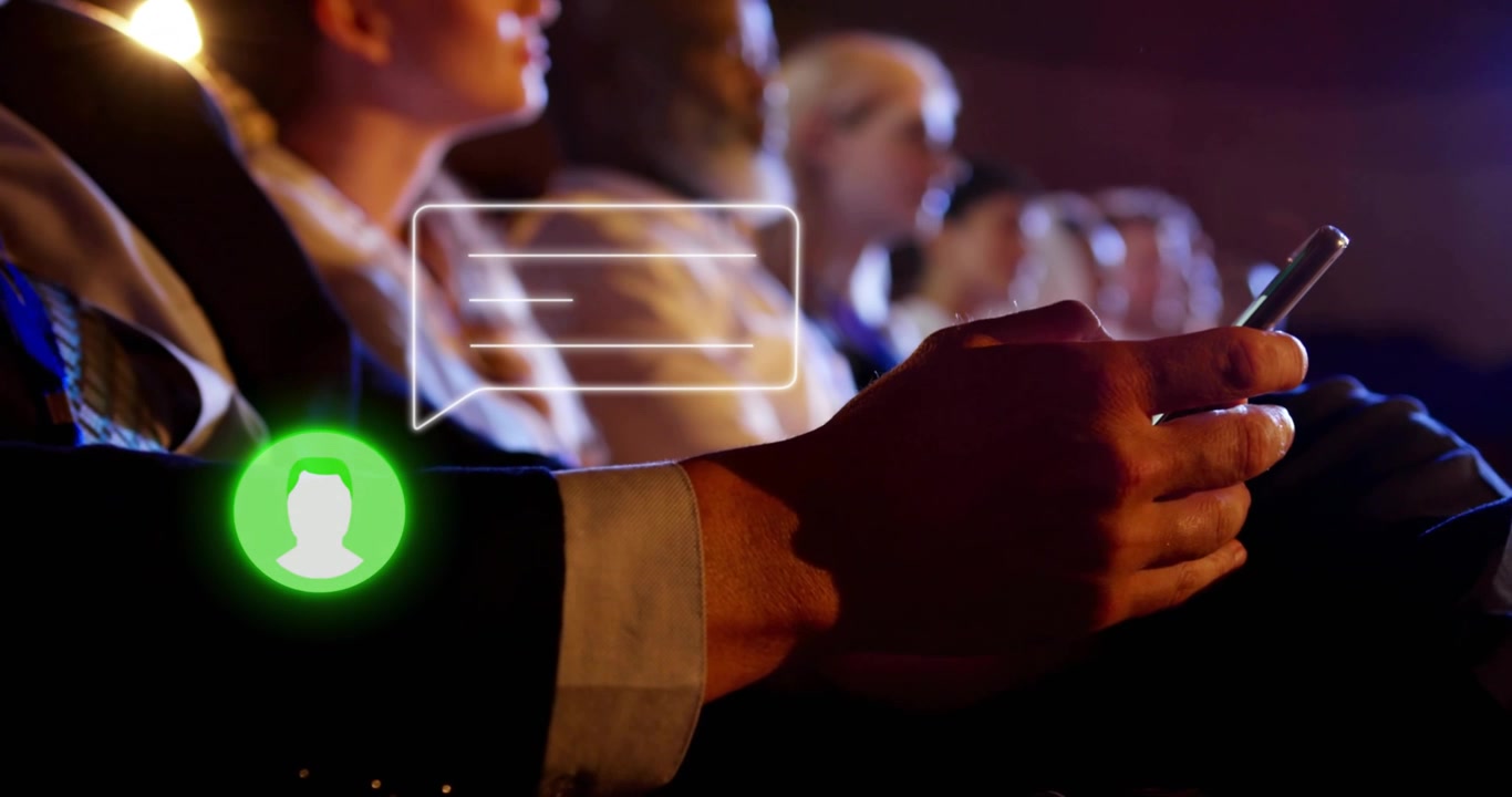 Conference attendee holding smartphone initiating pulsing chat bubble simulating incoming messages