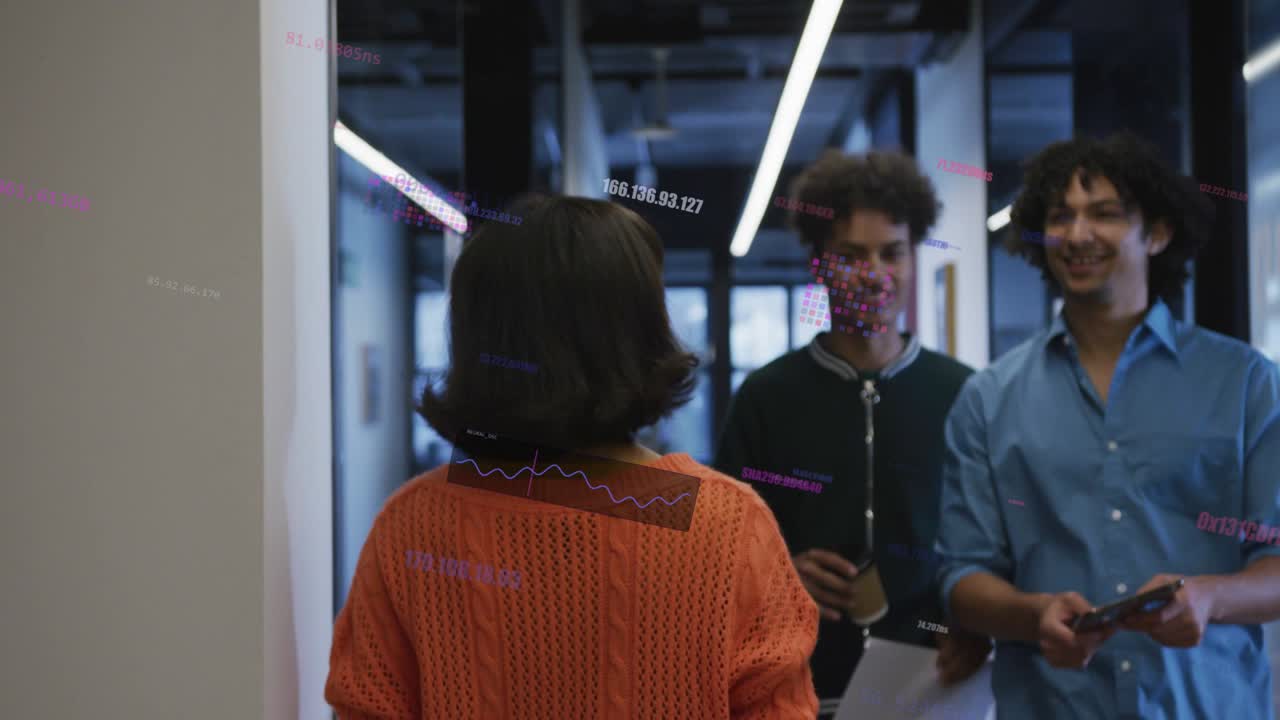 Woman walking office corridor, two coworkers entering holding phone, coffee, folder, exchanging hi