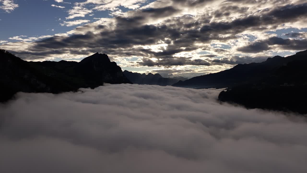 Majestic Mountain Sunrise Above a Sea of Clouds
