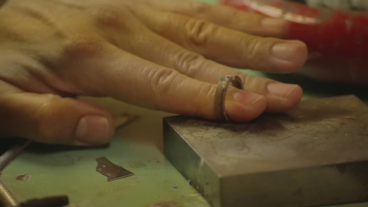 Italian Goldsmith at work building an engagement or a wedding ring