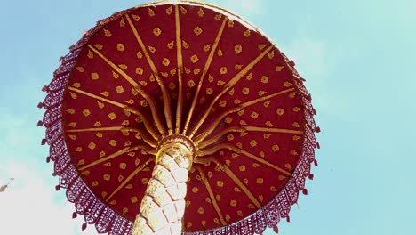 slow moving gold wood crafted parasol