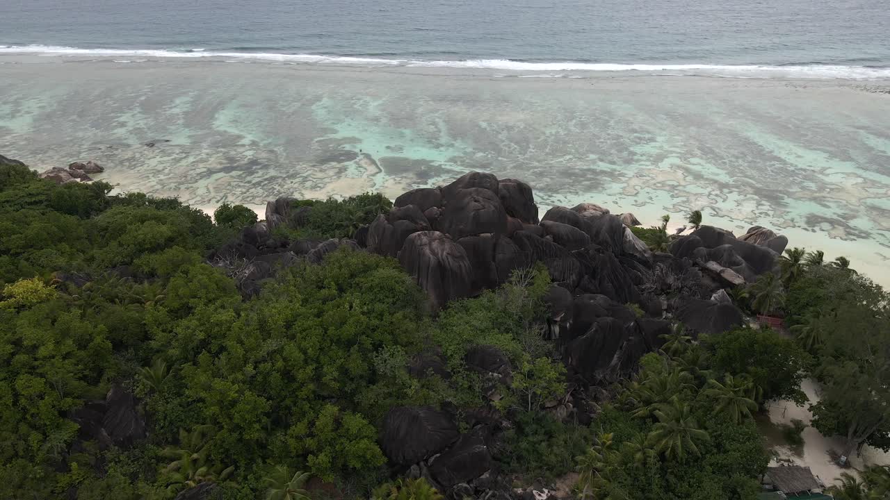 Anse Source d'Argent beach on island La Digue in Seychelles filmed from above
