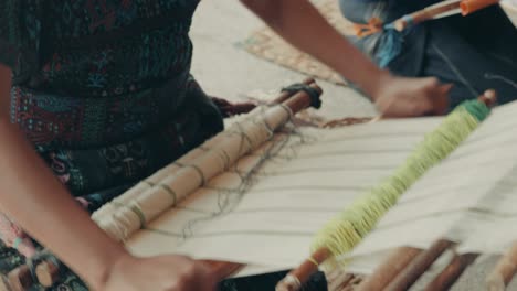 Mayan-Woman-Weaving-With-Backstrap-Looms-In-Guatemala,-Central-America---close-up