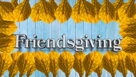 animation of friendsgiving text over orange autumn leaves on blue background