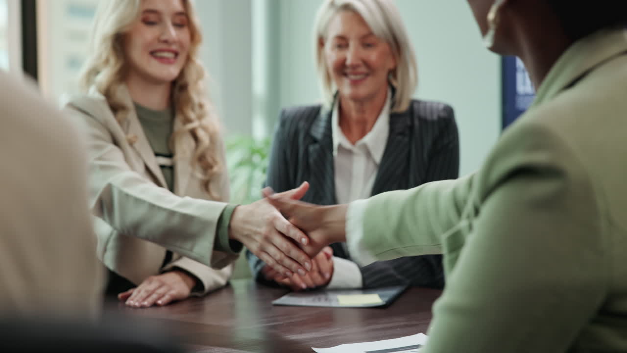 Businesswomen Shaking Hands at a Meeting