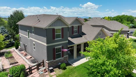 american flag waving on beautiful family house in colorado