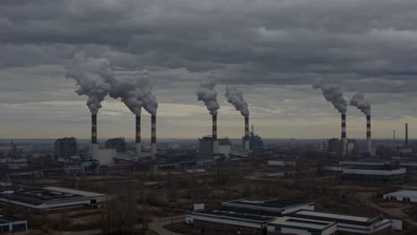 industrial plant with smoke stacks on an overcast day