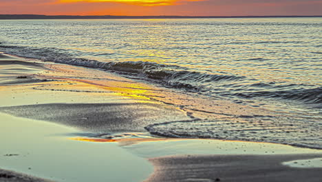 time lapse shot of waves reaching shore and beach on tropical island during sunset time
