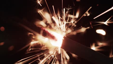 video of close up of sparkler and copy space on black background