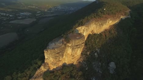 aerial view of mountain cliff and valley