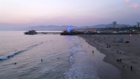 Aerial-Of-The-Santa-Monica-Pier-And-Ferris-Wheel-At-Night-Or-Dusk-Light-Los-Angeles-California-3