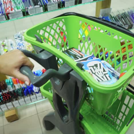 vinnitsa, ukraine - august 20, 2018: back to school concept, shopping cart at stationery department in shopping center