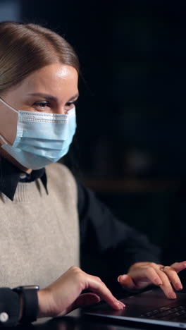 quarantine business work in medical mask. epidemic time protective businesswoman mask. vertical video