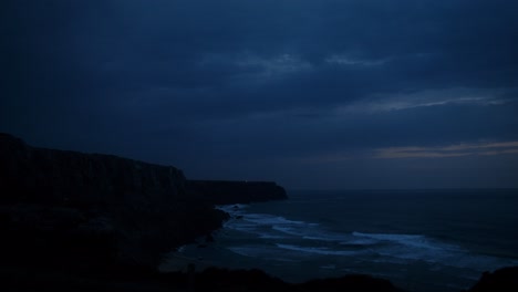 dark coastal scene at dusk/dawn