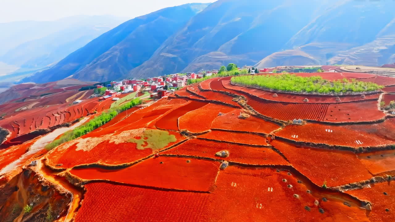 Beautiful landscape of red soil stones rocks, farm terrace rice field reflection with misty mountain backdrop