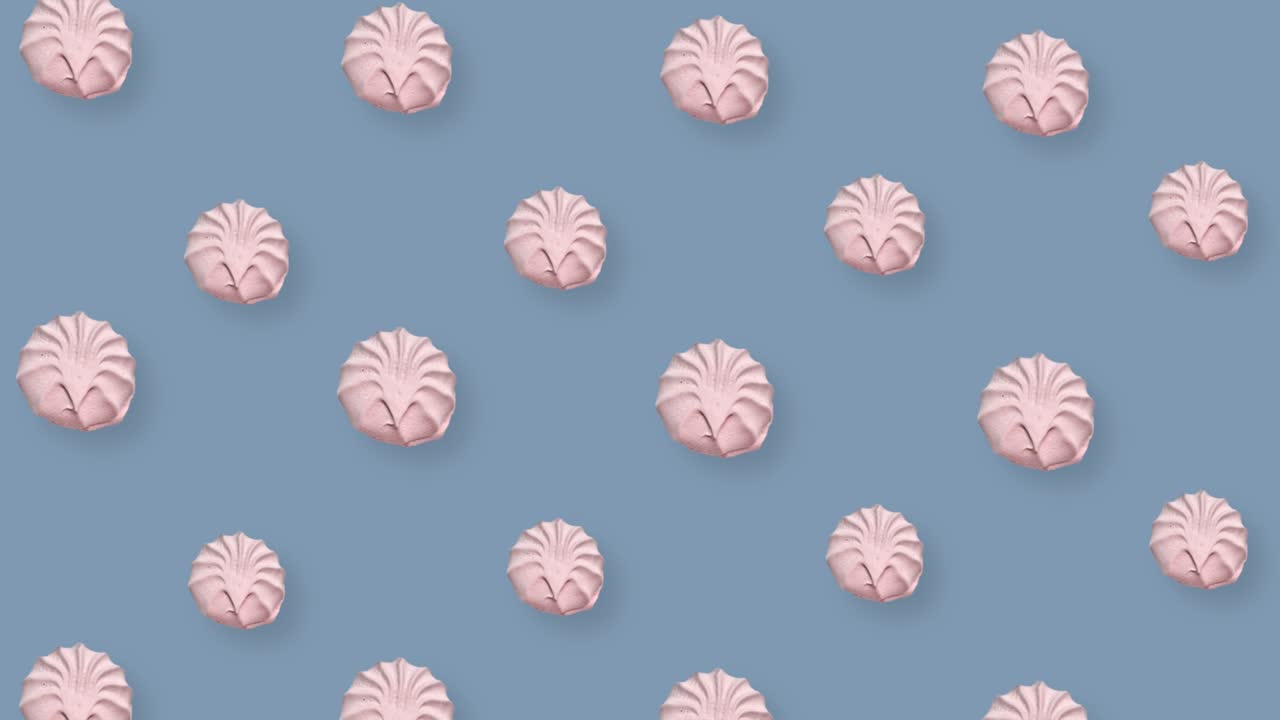 회색 배경에 분홍색 zephyr의 다채로운 패턴. zephyr. marshmallow. top view. realistic animation. 4k 비디오 모션.