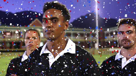 Digital-composite-video-of-multi-colored-confetti-falling-against-team-of-rugby-players-standing