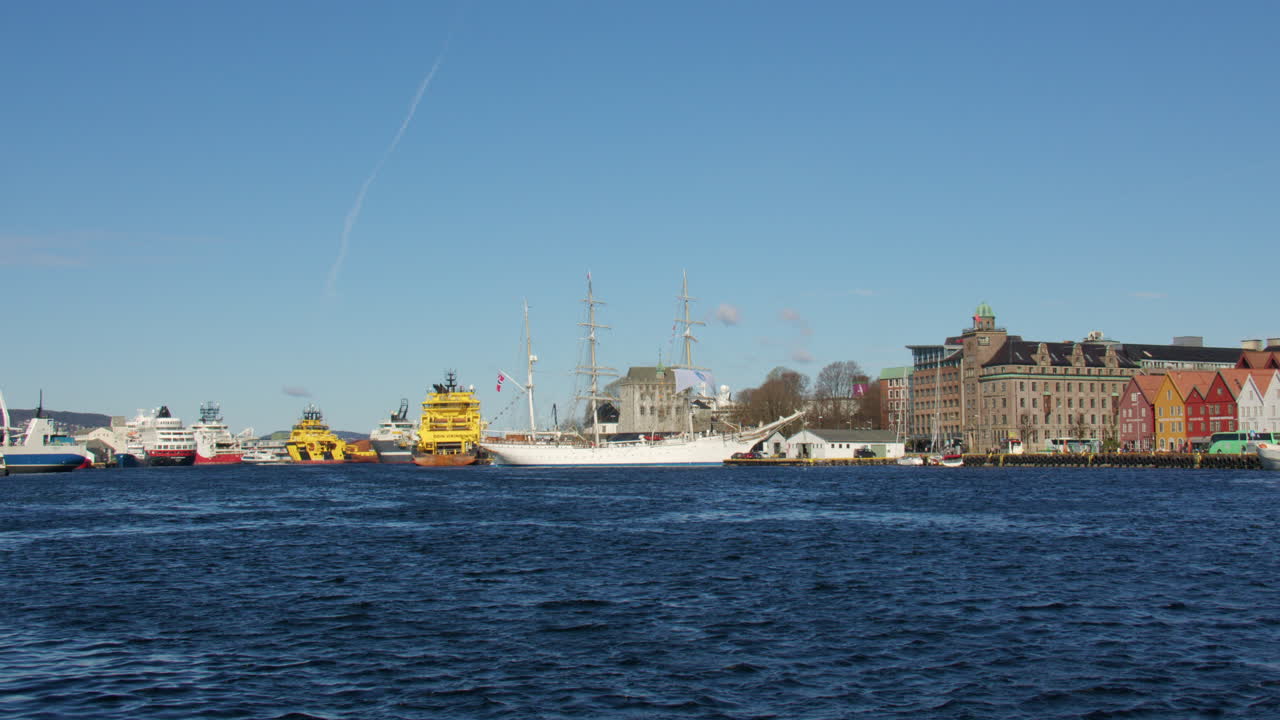Extra Wide shot of a tall ship moored up in the Harbour Vagen bay at Bergen