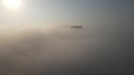 cityscape shrouded in morning fog