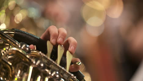 close-up of musician playing french horn