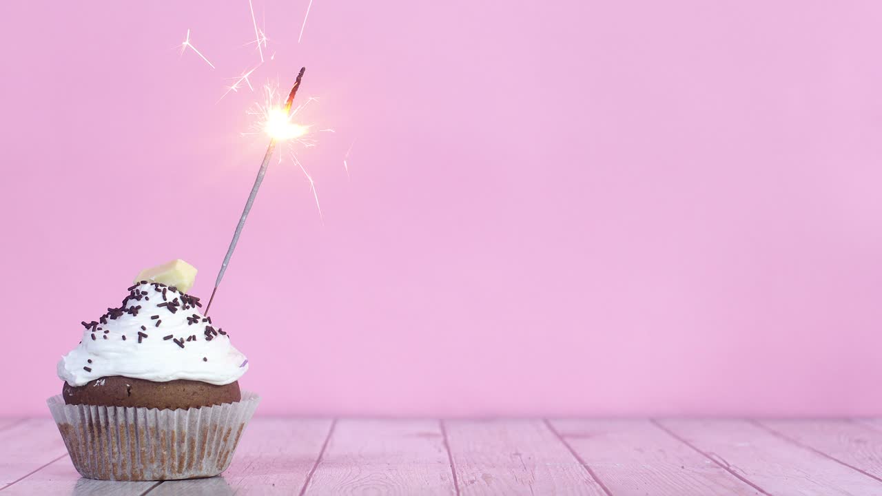 Burning up fire candle on testy sweet chocolate cup cake with white cream