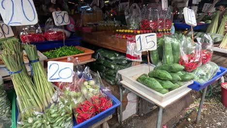 various vegetables displayed at a vibrant market stall