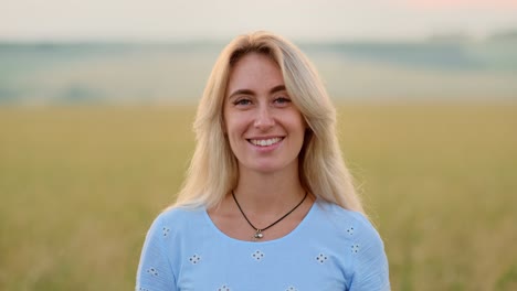 woman smiling in a golden field