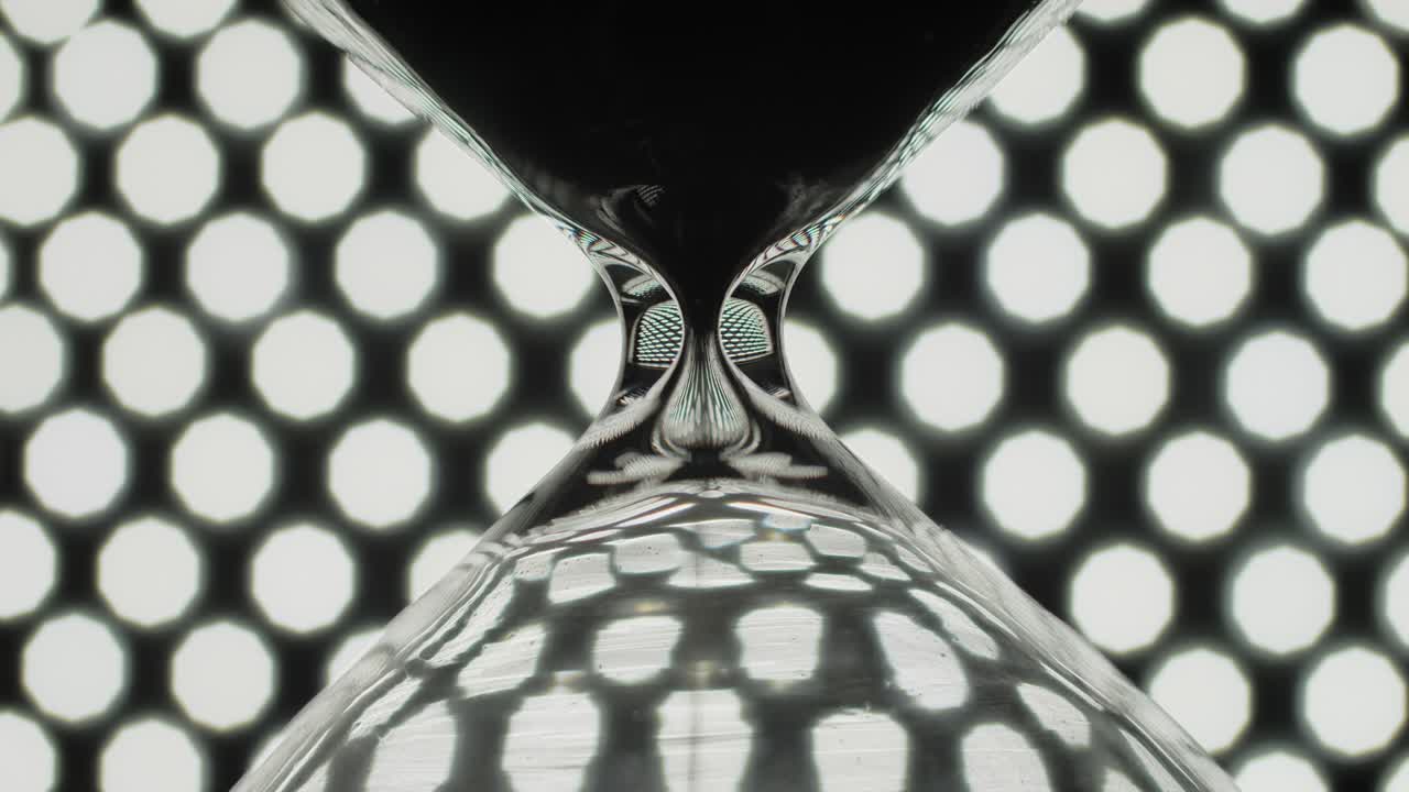 Sand clock on background of bokeh lights