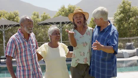 happy diverse senior friends welcoming guest to sunny garden party, unaltered, in slow motion