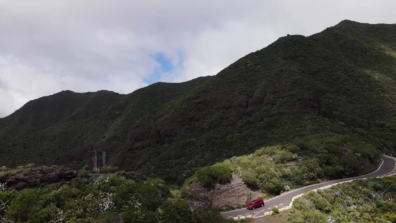 Beautiful mountains in Tenerife with street and red car
