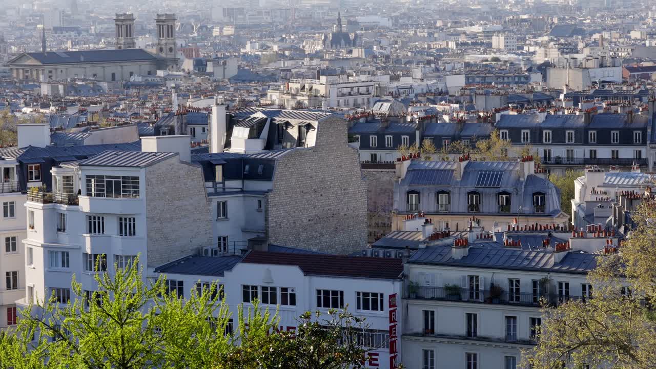 Calming and beautiful Wide angle view of Paris cityscape with buildings with blue roofs from Montmartre.