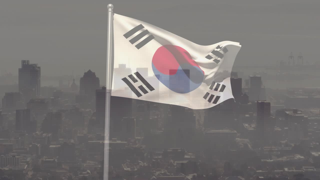 Gusts unfurling South Korean flag on pole, revealing taegeuk and trigrams against hazy skyline