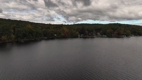 An-aerial-view-over-Oscawana-Lake-in-NY-during-the-fall-on-a-cloudy-day