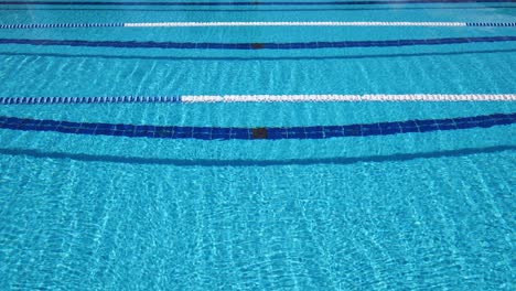 olympic swimming pool background on a bright sunny day