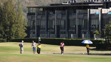 golfers enjoying a game on a sunny day