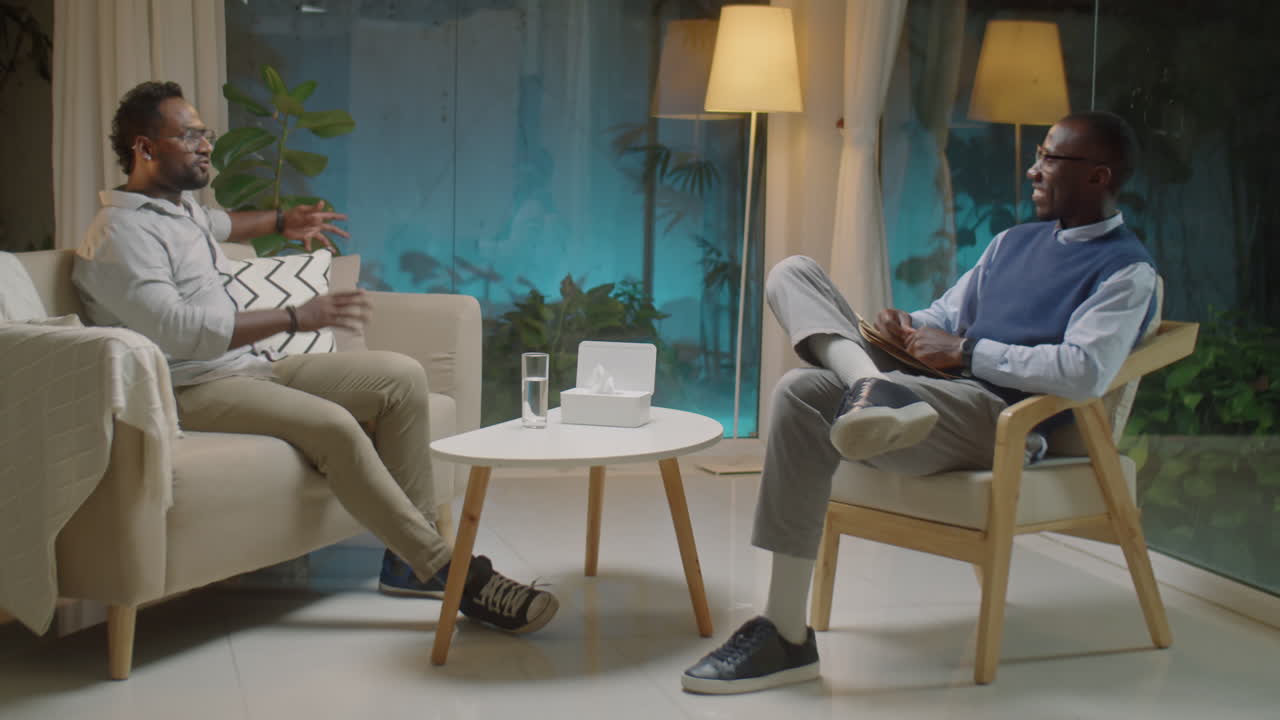 Man Shaking Hands and Talking with Psychologist on Counseling Session