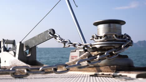 boat deck detail with anchor chain and winch