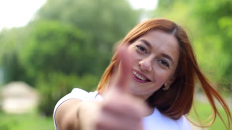 happy brunette girl takes off her sleep mask and replies on social networks using her phone after happy brunette girl takes off her sleep mask and replies on social networks using her phone after waking up in bed in the morning