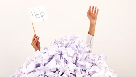 Hands-of-businesswoman-asking-for-help-on-a-paper-waste