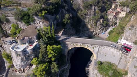 fiordo di furore bridge on amalfi coast, aerial drone rising reveal