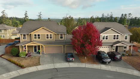 orbiting aerial view of a suburban residence during autumn