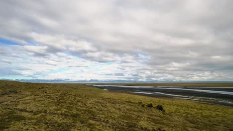 timelapse of clouds moving over a river in a typical iceland landscape 4k