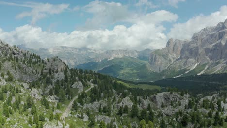 fly above panorama landscape in dolomites mountain range, tyrol, italy