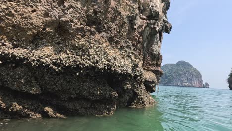 passing by towering limestone cliffs at sea