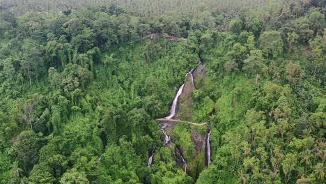 aerial landscape of waterfall kerta gangga in the middle of mountain jungle in lombok indonesia