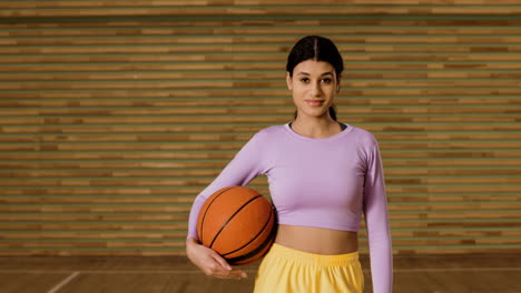 Sporty-girl-in-basketball-court
