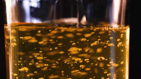 effervescent apple juice filling a glass