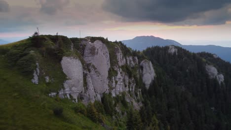 Experience-the-beauty-of-a-summer-mountain-ridge-at-sunset-with-vibrant-colors,-captured-by-a-mesmerizing-drone-footage